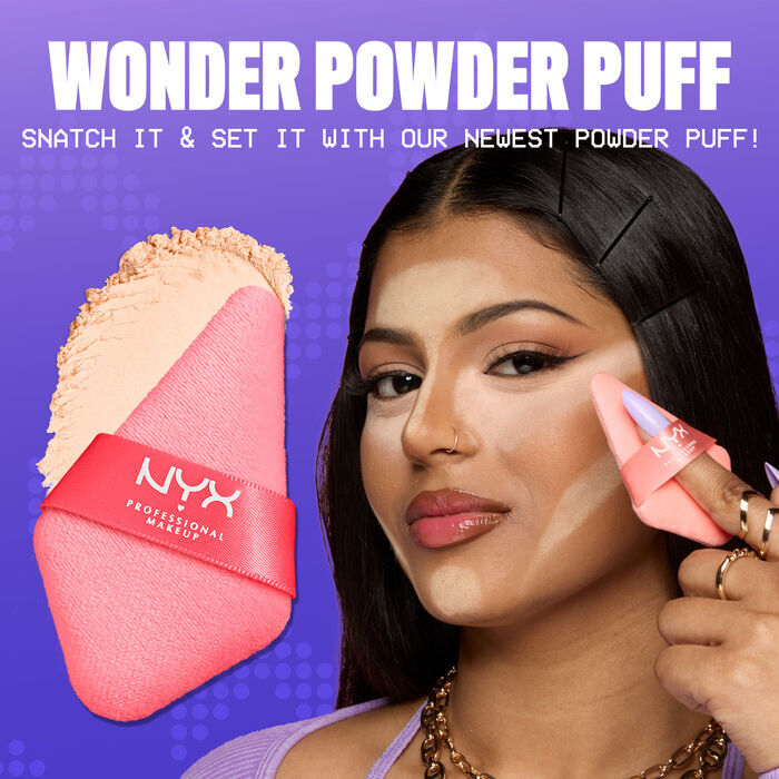 Model with marked areas for setting powder placement holding Wonder Snatch Powder Puff for cross-sell