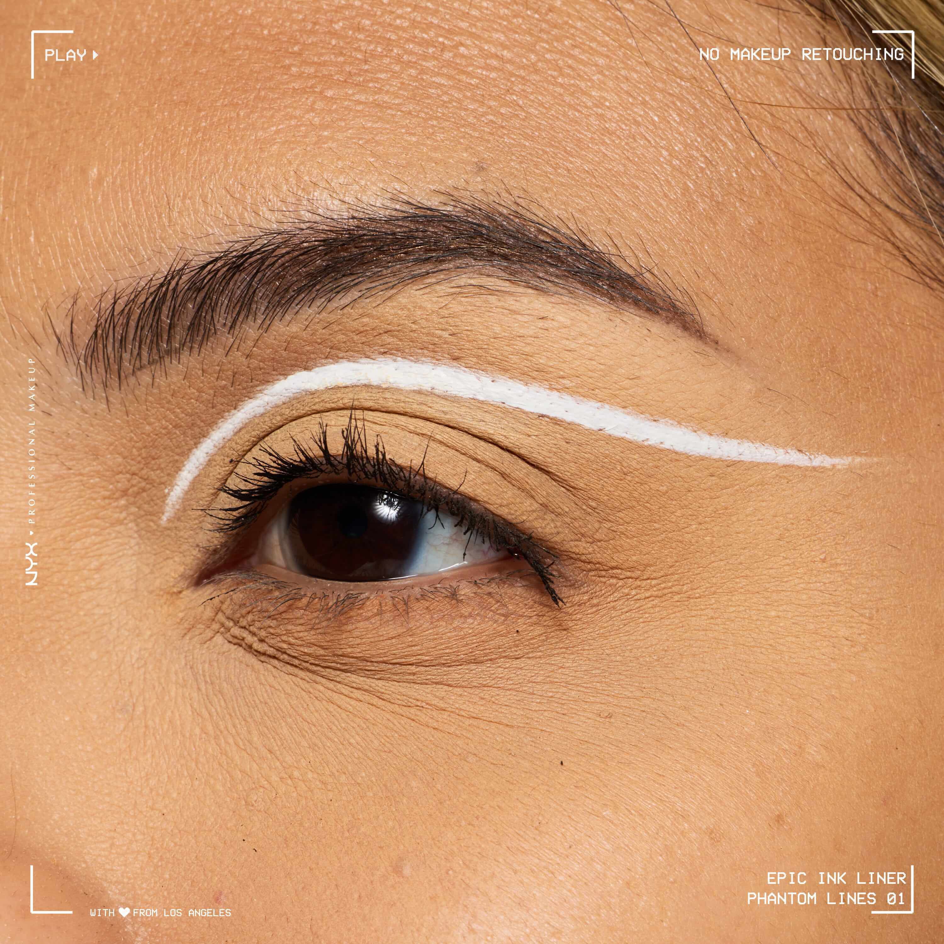Close-up of an eye wearing NYX Professional Makeup Party Animals Epic Ink Liner in Phantom Lines as a crisp white graphic eyeliner design.
